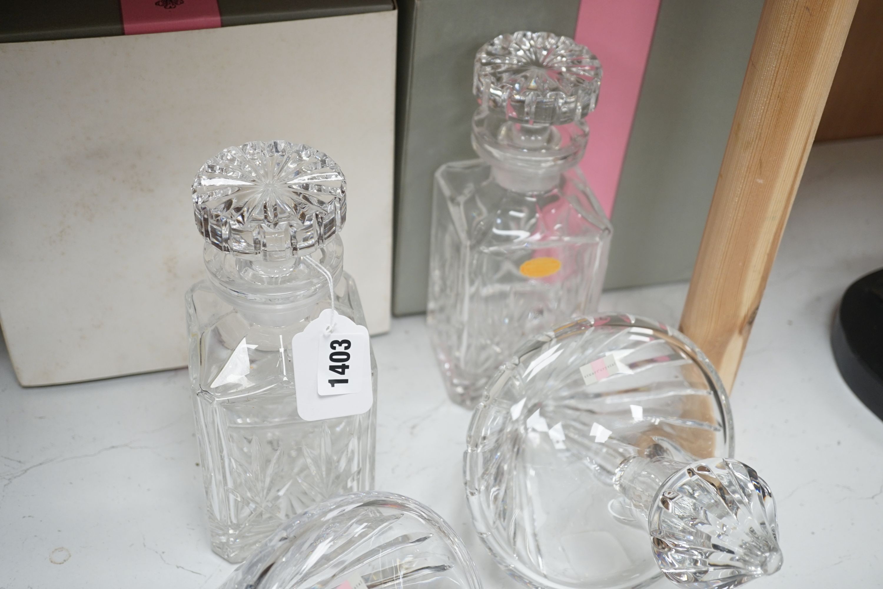 A pair of spirit decanters and a boxed pair of novelty Stuart 'rest' decanters.